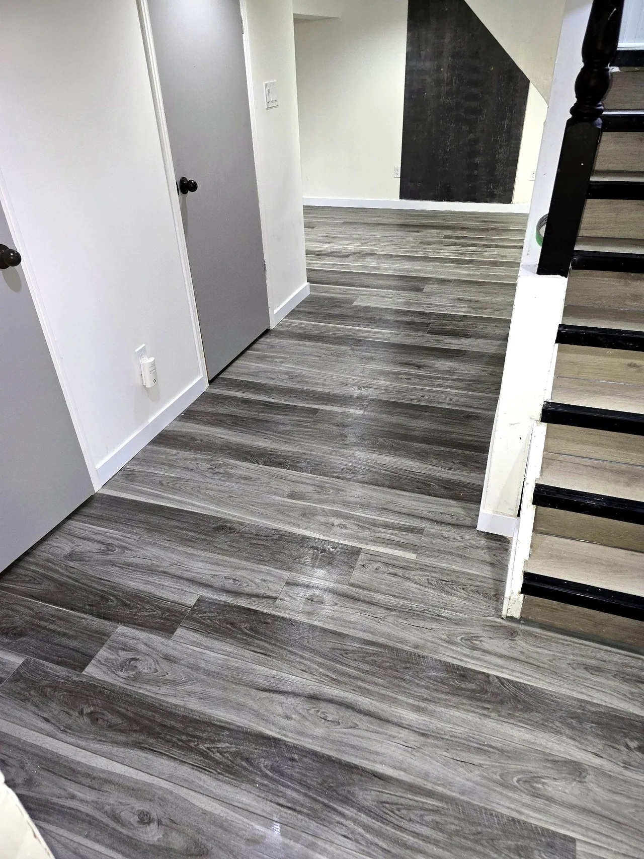 Full Basement Finishing — Flooring Installation: after photo 1